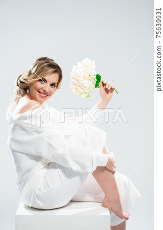 Glamour portrait of beautiful woman model with fresh daily makeup and romantic wavy hairstyle. Glamour portrait of beautiful woman model with fresh daily makeup and romantic wavy hairstyle. 75639931