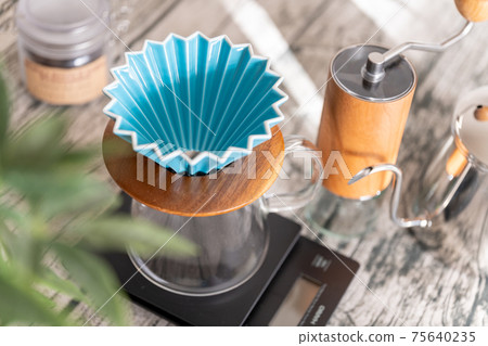 Coffee paper drip origami ripper turquoise before extraction Coffee paper drip origami ripper turquoise before extraction 75640235