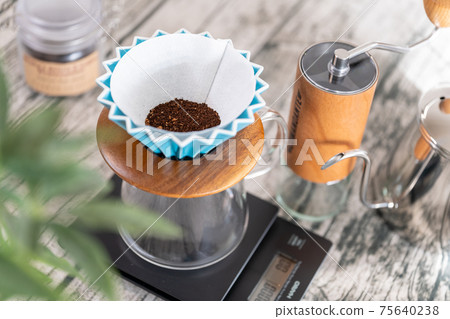 Coffee paper drip origami ripper turquoise before extraction 75640238