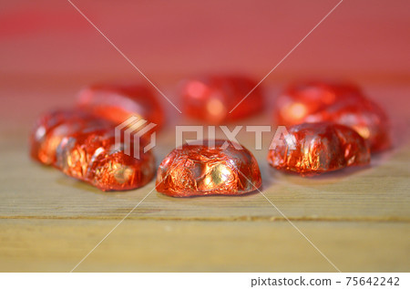 Heart shape chocolate candies. Red chocolate hearts candies Heart shape chocolate candies. Red chocolate hearts candies 75642242