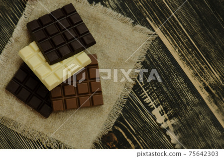 Mix chocolate bars of different colors and types. 75642303