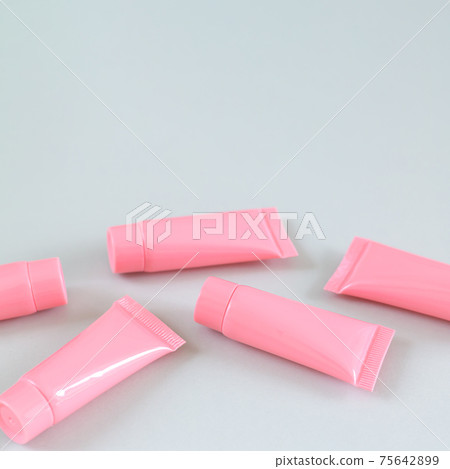Cosmetic tubes on gray background, spa product containers design Cosmetic tubes on gray background, spa product containers design 75642899