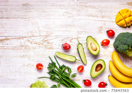 Healthy vegetables and fruits background. Healthy vegetables and fruits background. 75643563