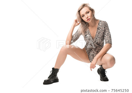 Trendy model in bodysuit and leather boots Trendy model in bodysuit and leather boots 75645250