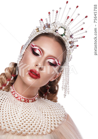 Beautiful woman in a creative style with bright makeup and white clothes and accessories Beautiful woman in a creative style with bright makeup and white clothes and accessories 75645788