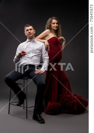 Stylish couple in elegant clothes in studio Stylish couple in elegant clothes in studio 75645973