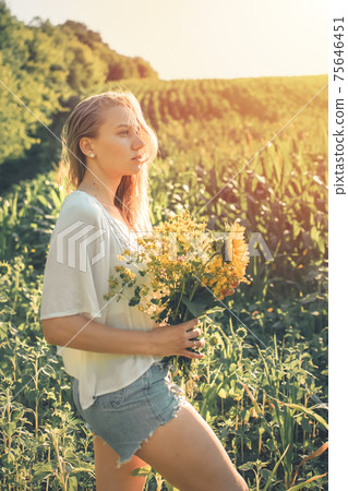 Vitamin D in Womens Health, Role of Vitamin D3 Supplements in female health. Young woman enjoying sun in nature background 75646451