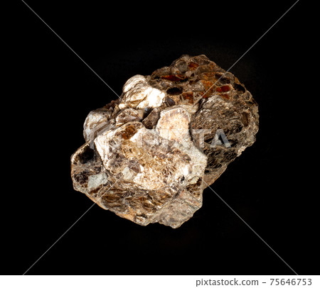 A couple of shiny muscovite mica mineral crystals isolated on black. Found in Volodar Volynsky, Ukraine. For geology mineralogy magazines or websites, stone collection catalog. 75646753