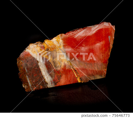 Red beautiful jasper mineral crystal from Orsk, Ural, Russia. A photo of a stone isolated on black. For geology or mineralogy websites, stone collection catalog, Natural Science museum wall charts. 75646773