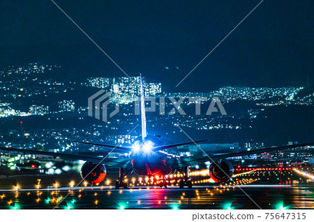 Night view of Itami Airport, airplane just before takeoff, Toyonaka City, Osaka Prefecture 75647315