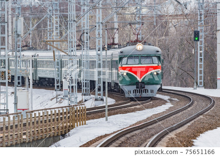 Retro passenger train approaches to the station. Retro passenger train approaches to the station. 75651166