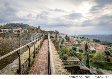The tower and wall of the fortress Montalcino Fortezza and and surroundings of Montalcino, Italy The tower and wall of the fortress Montalcino Fortezza and and surroundings of Montalcino, Italy 75652916