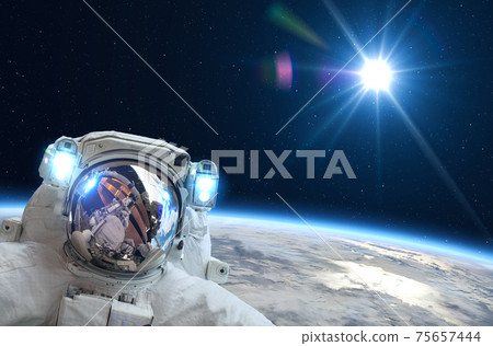 Astronaut, Space, Sun and Earth. Astronaut, Space, Sun and Earth. 75657444