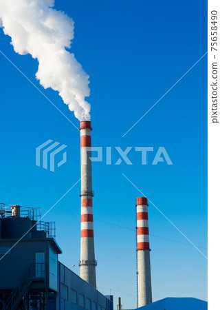 Industrial landscape, cranes, pipes with smoke. Air pollution from smokestacks, ecological problems. 75658490