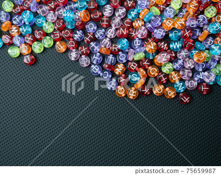 The alphabet bead multi color on black background  for  education concept 75659987