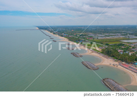 Aerial view of Nakhon Si Thammarat sea, beach in Thailand in summer season, urban city with blue sky for travel background. Chon buri skyline. 75660410