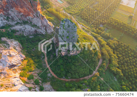Khao Kuha at Songkhla. Mountain hill with green forest trees. Nature landscape background in Thailand. Huangshan mountain. Khao Kuha at Songkhla. Mountain hill with green forest trees. Nature landscape background in Thailand. Huangshan mountain. 75660474