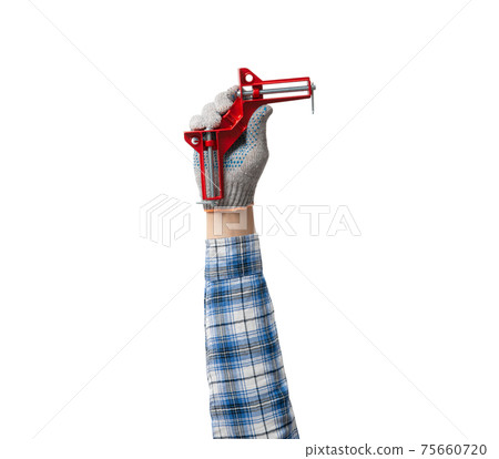 hand holds a construction tool - angular clamp for wood working hand holds a construction tool - angular clamp for wood working 75660720