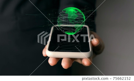 Human hand holding mobile phone with earth globe holographic technology Human hand holding mobile phone with earth globe holographic technology 75662152