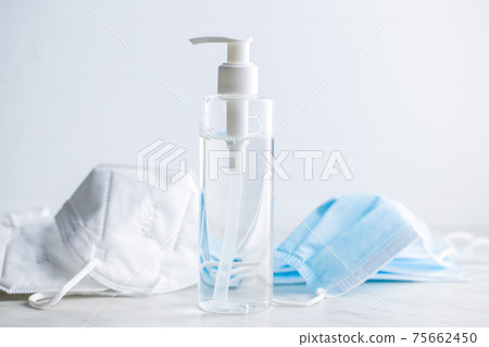 Coronavirus prevention hand sanitizer and kn95 respirator mask. Hand disinfectant gel in pump bottle. 75662450