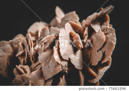 Desert rose crystal isolated on black background 75662896