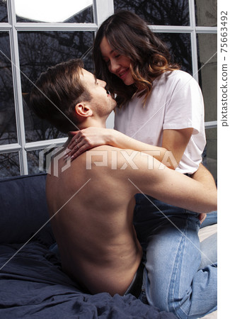young pretty couple together in bed sleeping chill, lifestyle people concept young pretty couple together in bed sleeping chill, lifestyle people concept 75663492
