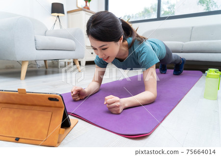 Woman exercise at home Woman exercise at home 75664014