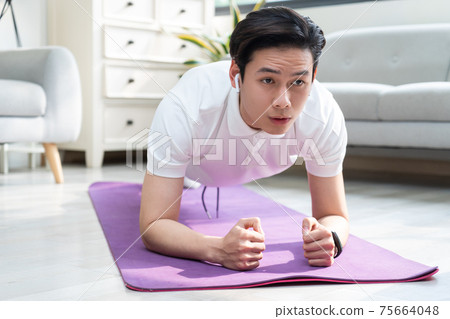 Man exercise at home Man exercise at home 75664048