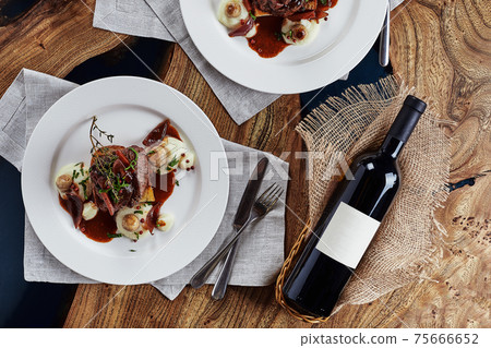Gourmet appetizer: Beautifully decorated catering banquet foie gras with berries 75666652