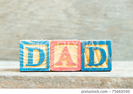 Color alphabet letter block in word dad on wood background Color alphabet letter block in word dad on wood background 75668500