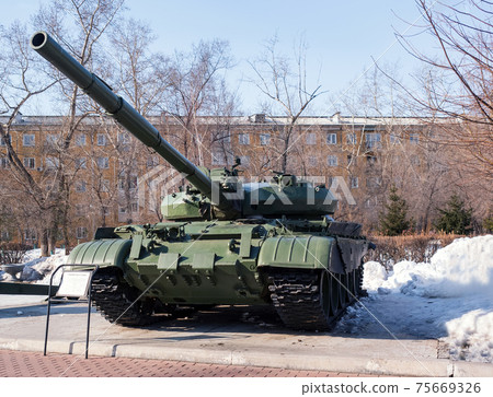 An old Soviet tank as military monument. Winter shooting. 75669326