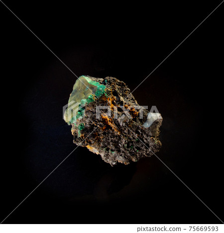 Malachite inside chalcedony mineral isolated on black background. For geology or mineralogy websites, stone collection catalog, Natural Science museum wall charts or posters Malachite inside chalcedony mineral isolated on black background. For geology or mineralogy websites, stone collection catalog, Natural Science museum wall charts or posters 75669593