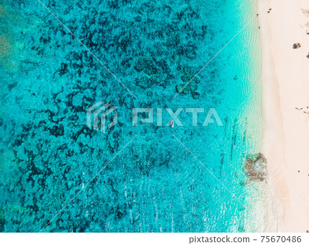Tropical beach with turquoise transparent ocean, aerial view. Gili islands Tropical beach with turquoise transparent ocean, aerial view. Gili islands 75670486