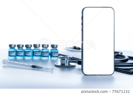 Smartphone mockup. Doctor stethoscope, hospital healthcare charts, syringe with needle and black smartphone with blank screen on medical equipment background. For design application, website project. Smartphone mockup. Doctor stethoscope, hospital healthcare charts, syringe with needle and black smartphone with blank screen on medical equipment background. For design application, website project. 75671132