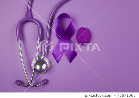 Purple day. World epilepsy day. Purple ribbon on purple background 75671365