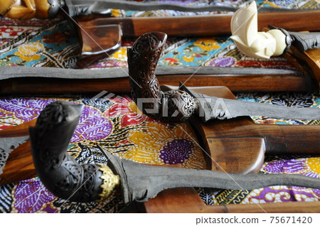Keris is a traditional weapon of the Malay community in Malaysia. Made manually by using the selected iron. The handle is made of wood or ivory. 75671420