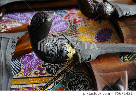 Keris is a traditional weapon of the Malay community in Malaysia. Made manually by using the selected iron. The handle is made of wood or ivory. 75671421