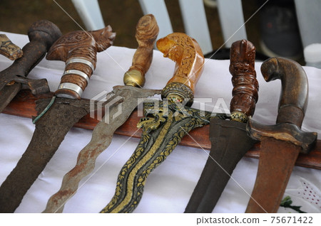 Keris is a traditional weapon of the Malay community in Malaysia. Made manually by using the selected iron. The handle is made of wood or ivory. 75671422