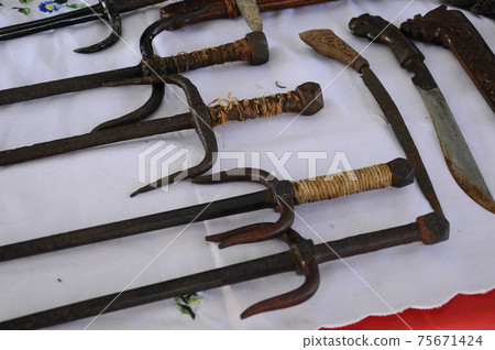 Keris is a traditional weapon of the Malay community in Malaysia. Made manually by using the selected iron. The handle is made of wood or ivory. 75671424
