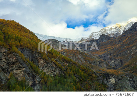 View of landscape snow alp mountain in autumn at countryside swiss 75671607