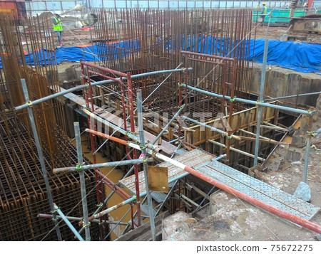 PUTRAJAYA, MALAYSIA -OCTOBER 13, 2017: Sheet pile cofferdam retaining wall at the construction site. It is installed to allow soil excavation and foundation work start. PUTRAJAYA, MALAYSIA -OCTOBER 13, 2017: Sheet pile cofferdam retaining wall at the construction site. It is installed to allow soil excavation and foundation work start. 75672275