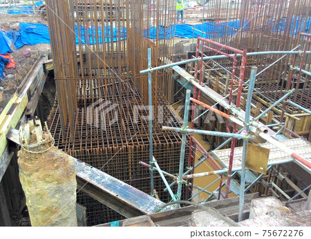 PUTRAJAYA, MALAYSIA -OCTOBER 13, 2017: Sheet pile cofferdam retaining wall at the construction site. It is installed to allow soil excavation and foundation work start. PUTRAJAYA, MALAYSIA -OCTOBER 13, 2017: Sheet pile cofferdam retaining wall at the construction site. It is installed to allow soil excavation and foundation work start. 75672276