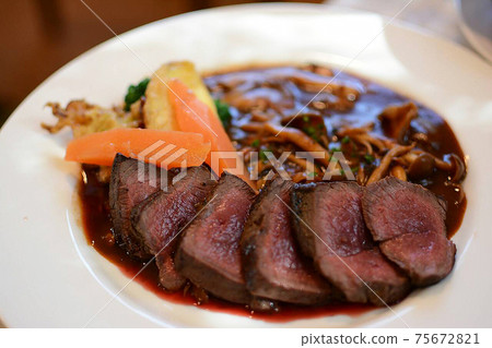 French bistro in Kobuchisawa, Hokuto City, Yamanashi Prefecture, venison steak red wine sauce at a Western dining restaurant. 75672821