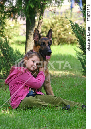 The girl and German shepherd 75673756