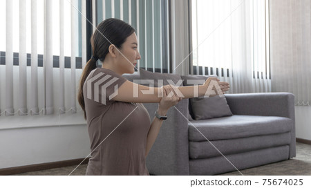Slim fit Asian woman  Internet coach yoga and meditation coaching videos make them feel relaxed, female happiness, Stretching the muscles of the body and practicing proper breathing, Exercise concept. 75674025