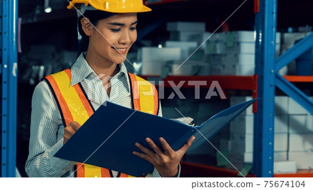 Female warehouse worker working at the storehouse Female warehouse worker working at the storehouse 75674104