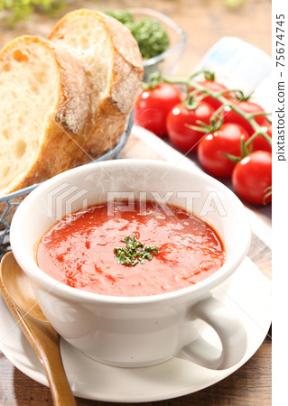 Steaming table tomato soup and bread Steaming table tomato soup and bread 75674745