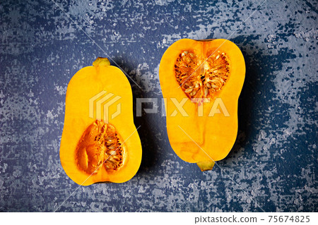 Pumpkin sort Butternut squash on grunge blue background. Pumpkin sort Butternut squash on grunge blue background. 75674825