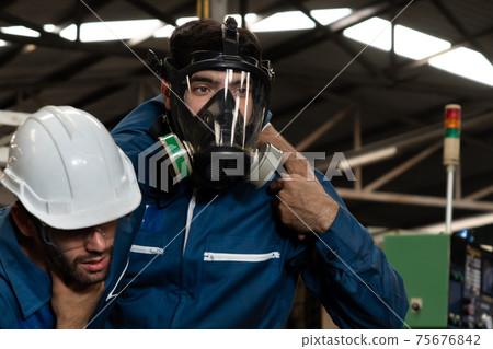 Skillful factory worker rescue his teammate out of poisonous gas leakage 75676842