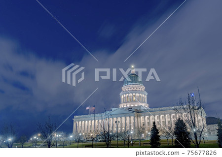 Utah State Capital Building glowing against sky and clouds in Salt Lake City 75677826